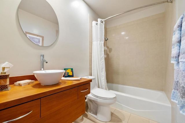 a bathroom with a toilet a sink and a mirror