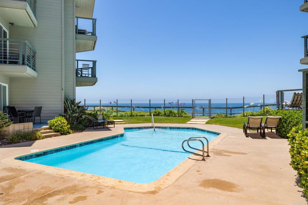 940 Sealane Drive, Unit 14 Encinitas, CA 92024 - Photo 31 of 45 a view of a swimming pool with a yard and sitting area