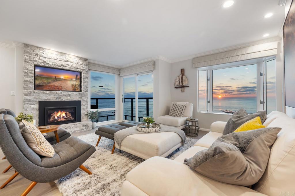 940 Sealane Drive, Unit 14 Encinitas, CA 92024 - Photo 32 of 45 a living room with furniture and a fireplace
