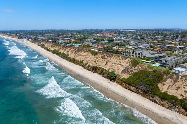 a view of a large building with a big yard and large trees