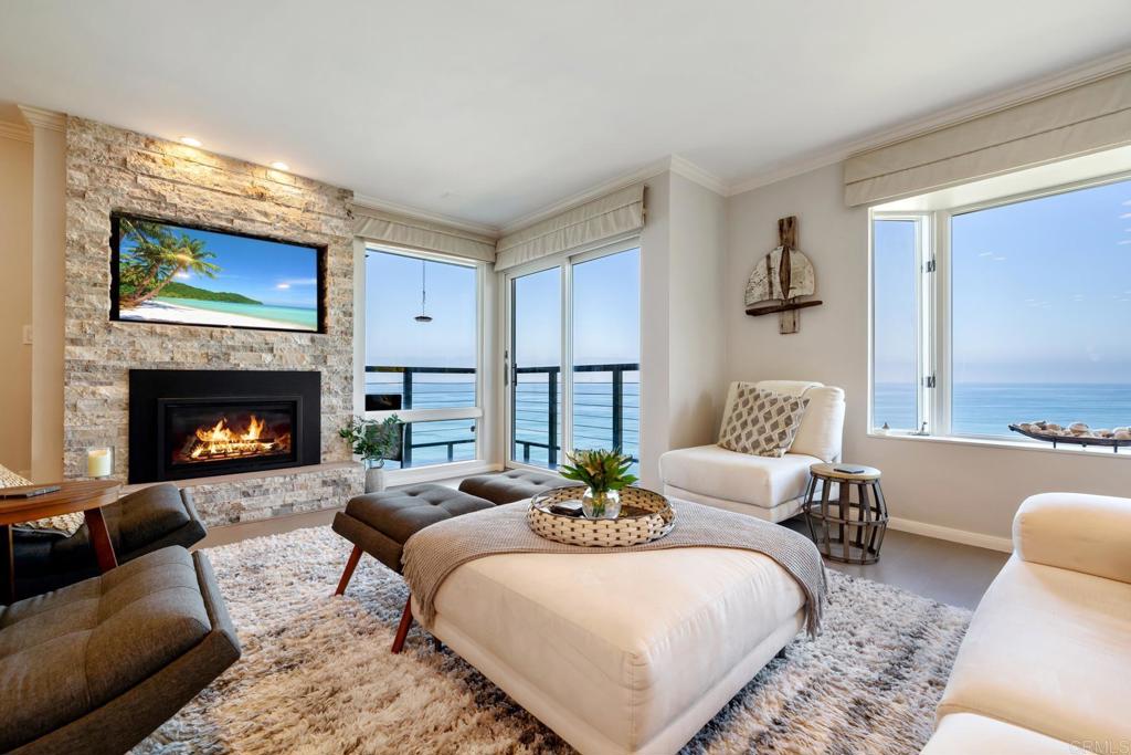 940 Sealane Drive, Unit 14 Encinitas, CA 92024 - Photo 6 of 45 a living room with furniture and a fireplace