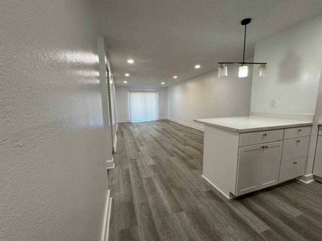 5525 Southwest 41st Street, Unit 306 Hollywood, FL 33023 - Photo 2 of 11 a view of a kitchen with a dishwasher and wooden floor