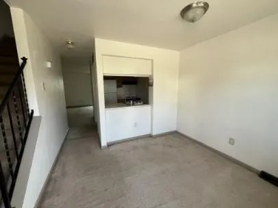 a view of a hallway with a bathroom