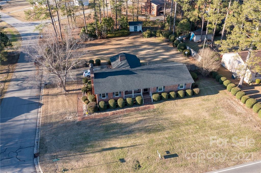 1127 Richmond Road, Unit 1 & 22 Rockingham, NC 28379 - Photo 1 of 41 a view of street along with trees