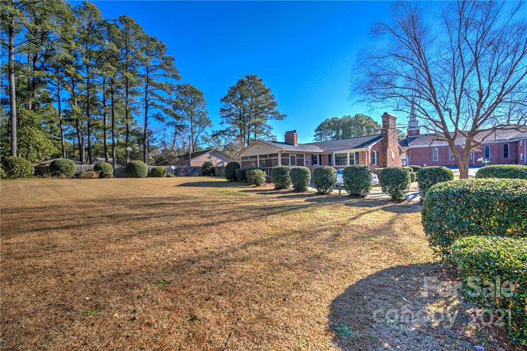 1127 Richmond Road, Unit 1 & 22 Rockingham, NC 28379 - Photo 38 of 41 a view of a house with a yard