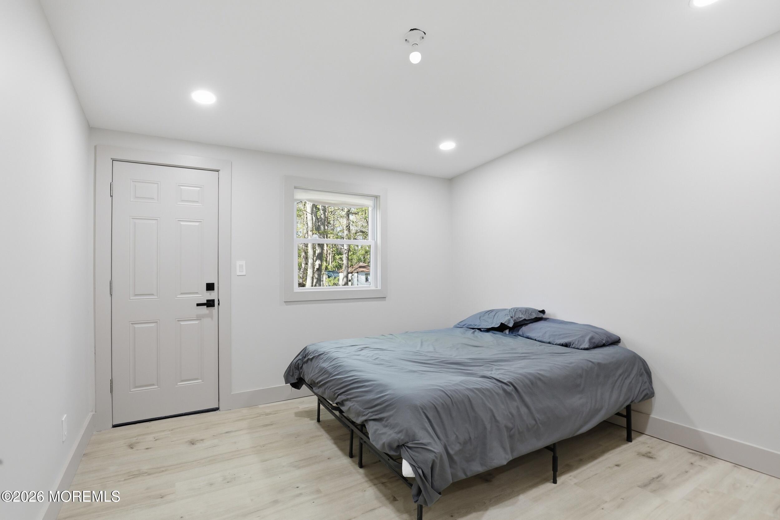 492 Cobain Road Jackson, NJ 08527 - Photo 24 of 47 a bedroom with a bed and a window