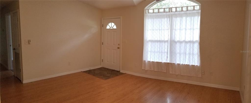 1221 Northwest 35th Avenue Gainesville, FL 32609 - Photo 4 of 16 an empty room with windows and closet