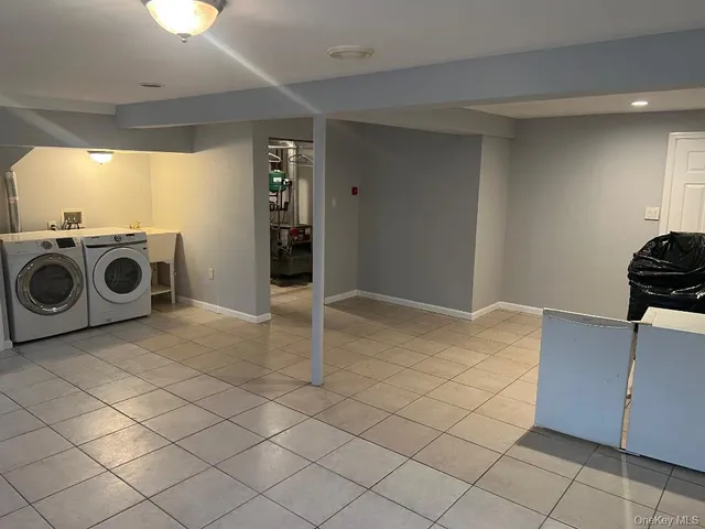 a view of kitchen with furniture and cabinets