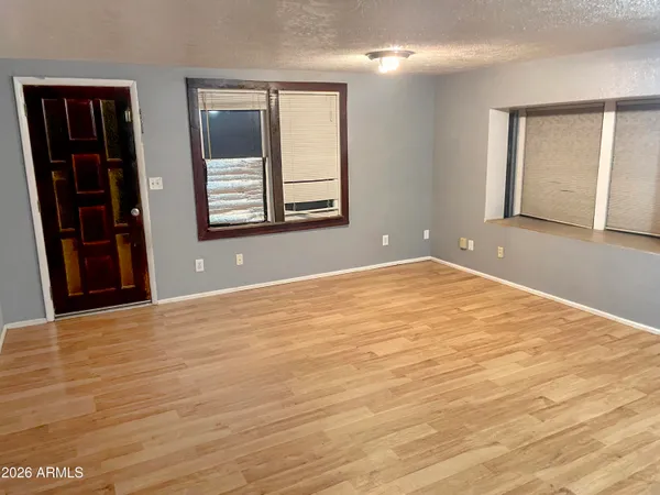 a kitchen with wooden cabinets and a stove top oven