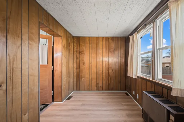 a view of an entryway with wooden floor
