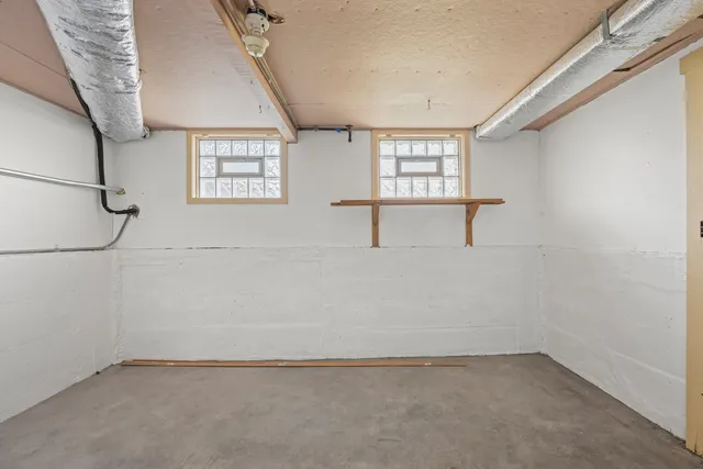 a view of empty room with windows