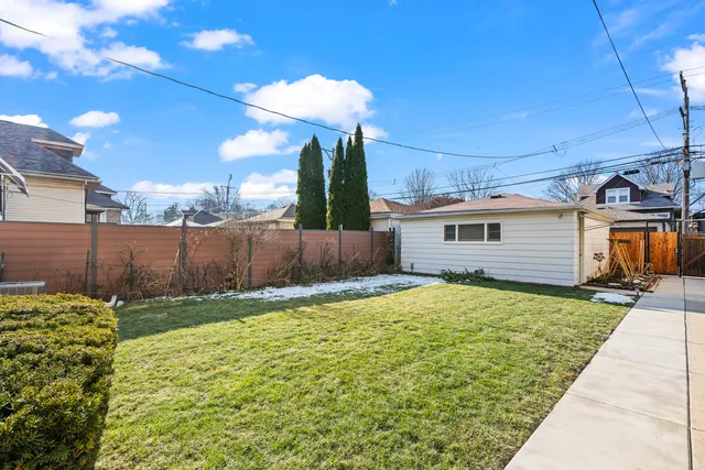 a view of a backyard of the house