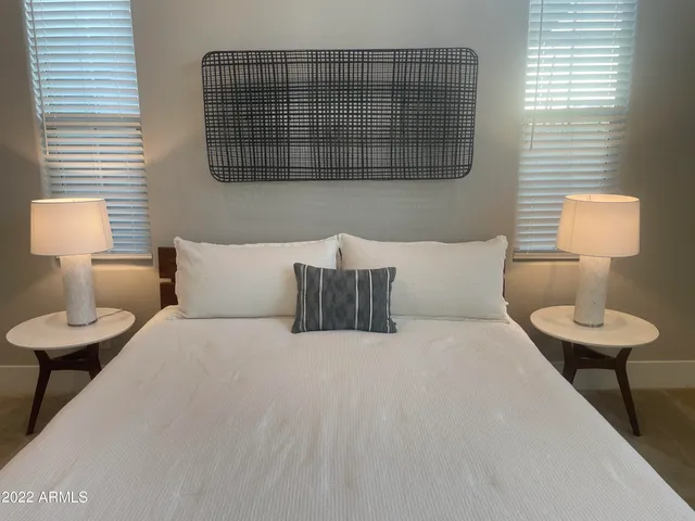 a bedroom with a bed and a couch