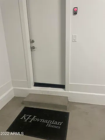 a wooden bench sitting in front of a building