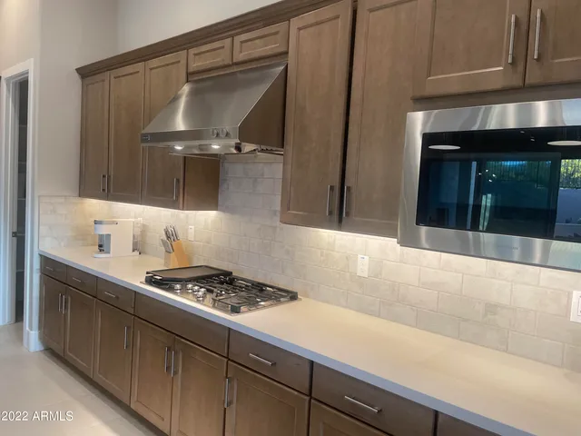 a kitchen with a sink and a stove