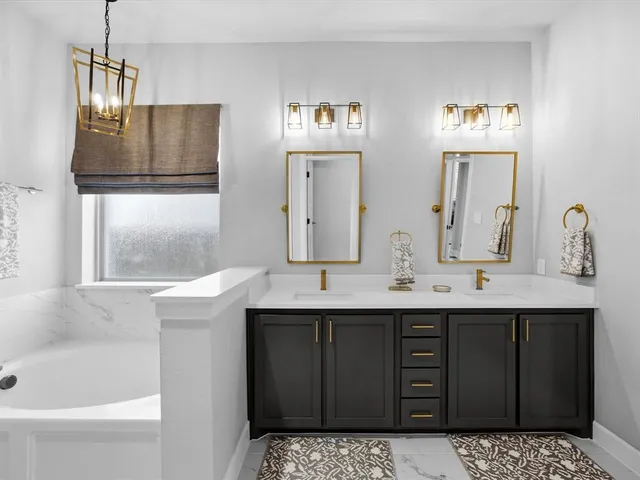 a bathroom with a bathtub and a shower