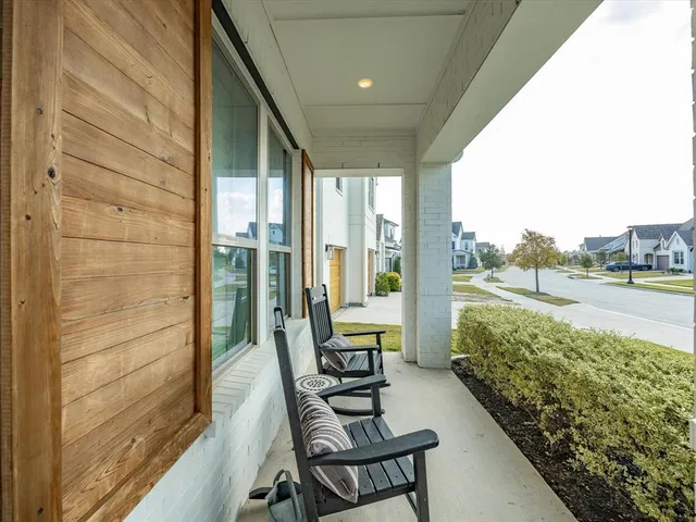 a view of a balcony with lake view and a floor to ceiling window