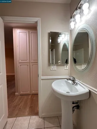 a kitchen with granite countertop a stove and a sink