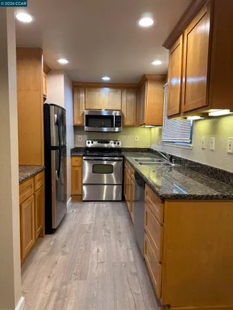 a view of hallway with wooden floor
