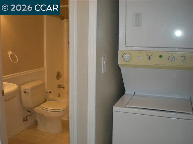 a kitchen with granite countertop a refrigerator and a stove