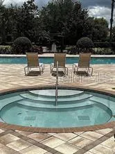 a view of swimming pool with a yard