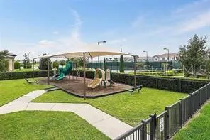 a view of a swimming pool and outdoor seating
