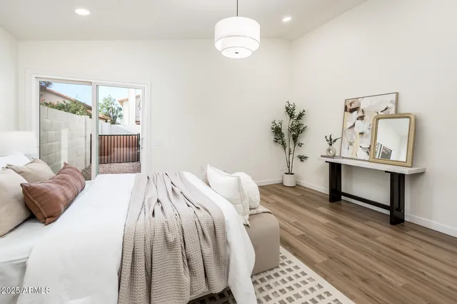 a bedroom with a bed and a table