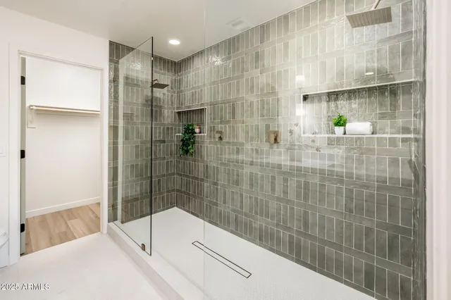a bathroom with a bathtub and a shower