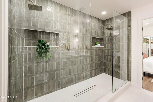 a bathroom with a bathtub and shower