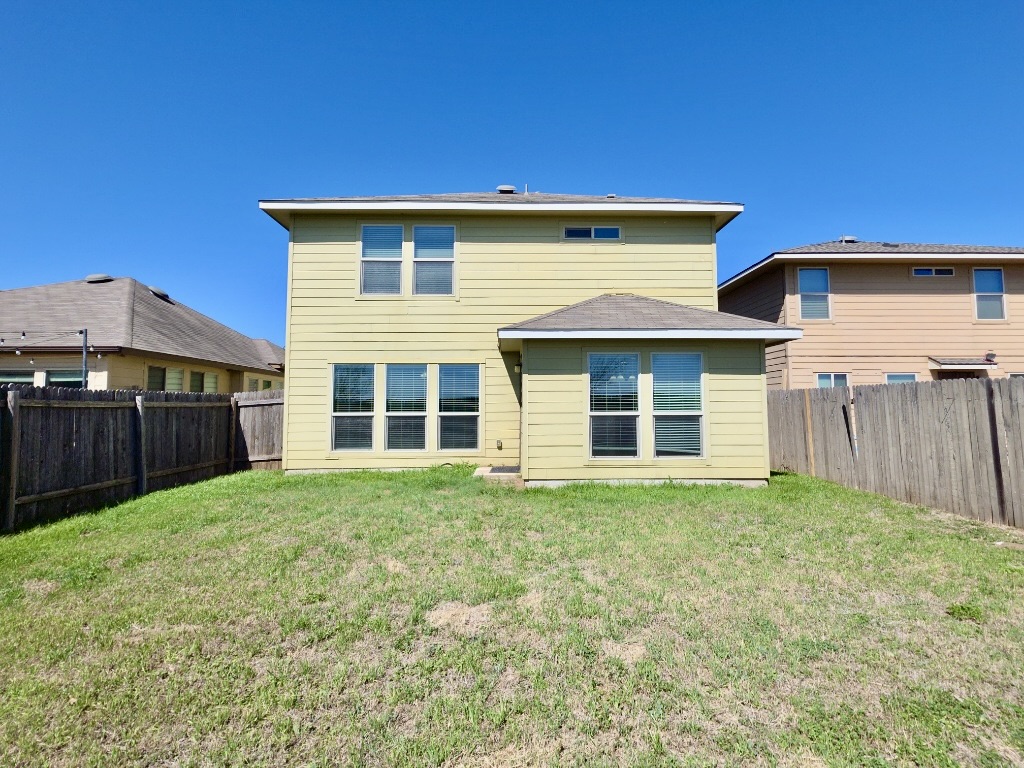 809 Yabers Court Austin, TX 78725 - Photo 28 of 29 Rear view of property with a fenced backyard