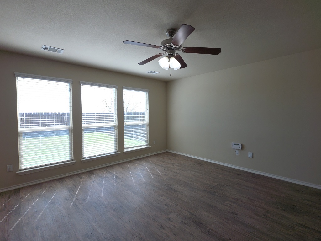 809 Yabers Court Austin, TX 78725 - Photo 6 of 29 Living room with ceiling fan and dark wood-type flooring