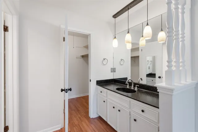 a bathroom with a double vanity sink and mirror