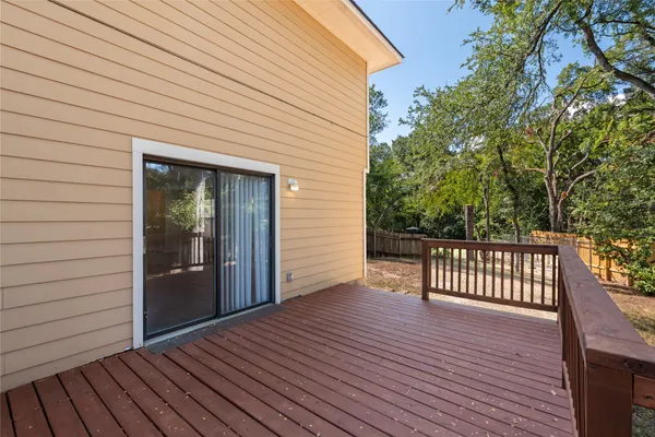 a view of backyard with a deck