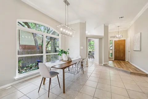 a view of a dining room with furniture window and outside view