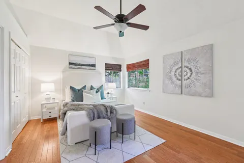 a bed room with a bed and a chandelier