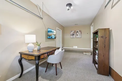 a workspace with furniture and window