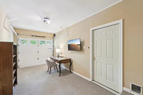 a workspace with furniture and a window