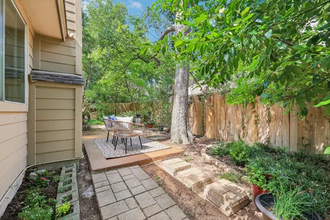 a view of a bench in the backyard