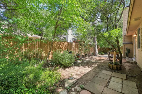 a view of yard with green space and seating area