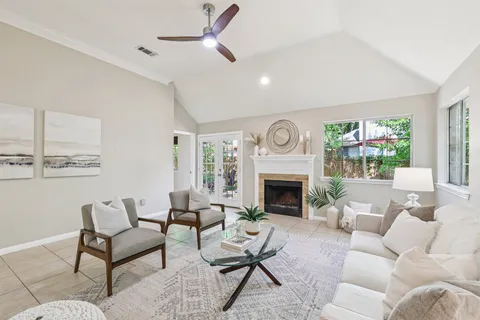 a living room with furniture and a fireplace
