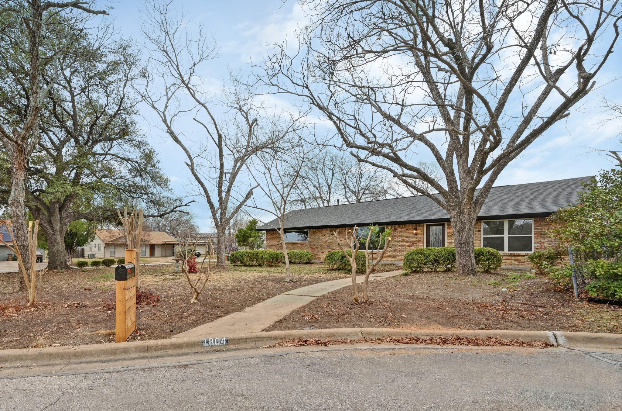 Classic Austin charm on a quiet cul-de-sac beneath mature trees.
