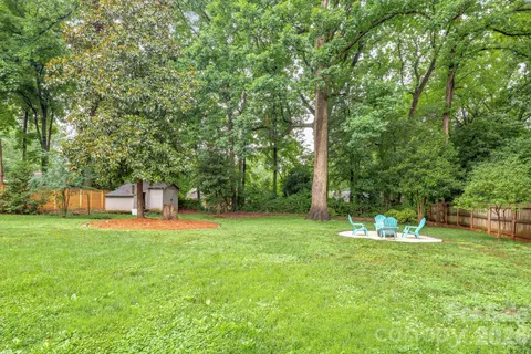 a backyard of a house with a patio and a garden