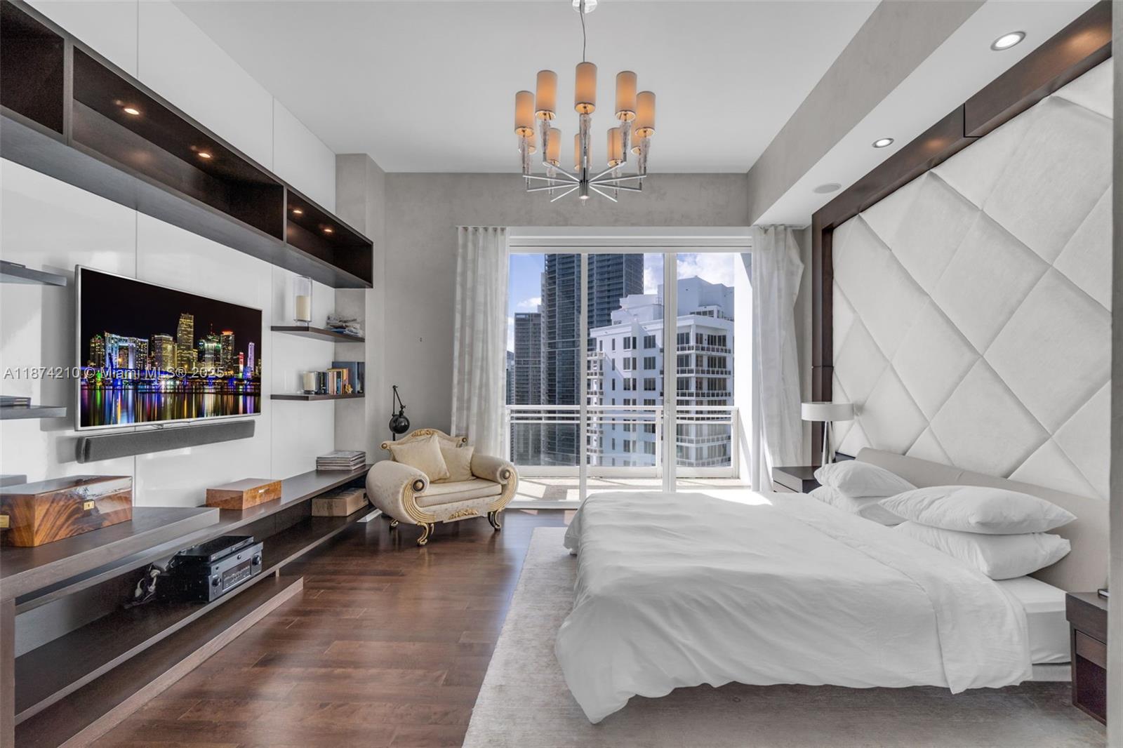 900 Brickell Key Boulevard, Unit 2904 Miami, FL 33131 - Photo 11 of 21 a spacious bedroom with a bed couch and window