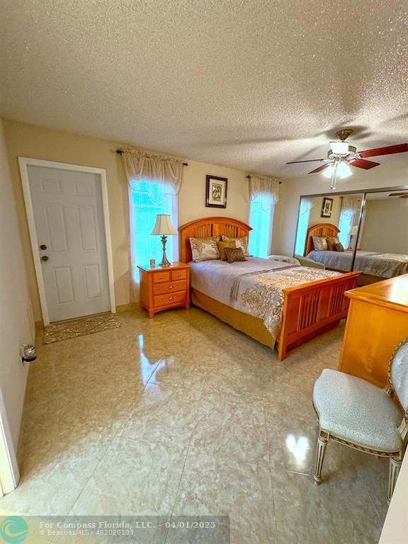 4525 Northwest 3rd Court Delray Beach, FL 33445 - Photo 13 of 23 a bedroom with two beds and painting on the wall