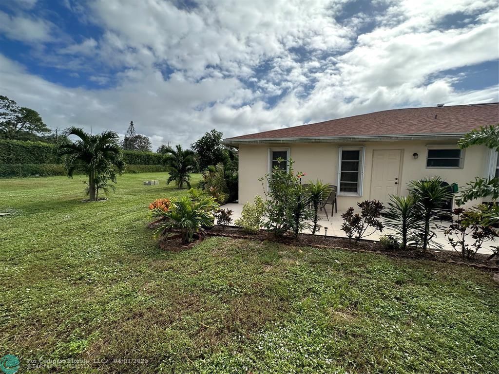 4525 Northwest 3rd Court Delray Beach, FL 33445 - Photo 21 of 23 a view of a house with a yard and sitting area