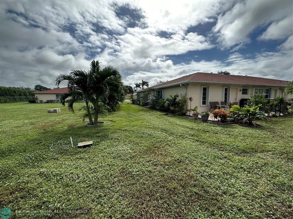 4525 Northwest 3rd Court Delray Beach, FL 33445 - Photo 22 of 23 a view of a garden with a house