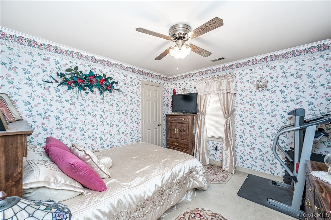 10900 Crofton Road Chester, VA 23831 - Photo 24 of 32 a bedroom with a bed and a flat screen tv