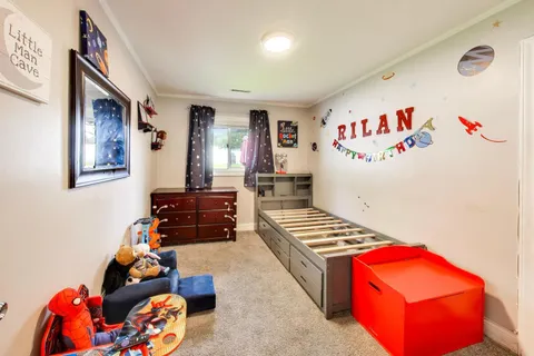 a bedroom with furniture and a window