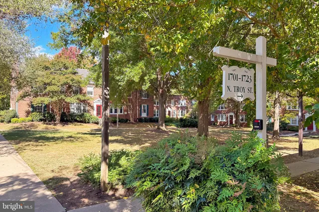 a view of a street with houses on both side