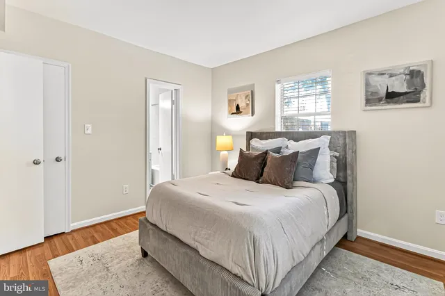 a bedroom with bed and window